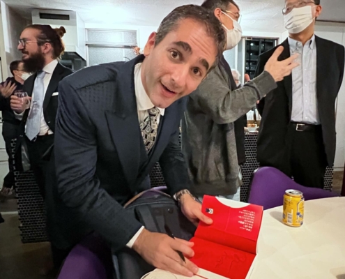 Benjamin Boas signing a copy of his new book